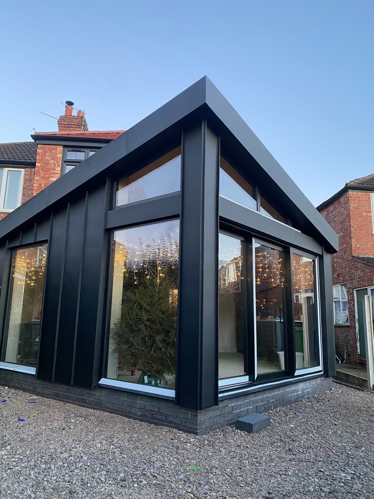 Standing seam garden room cladded top to toe in GreenCoat plx Black 